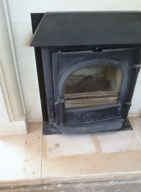 Limestone Fireplace Showing Flood Staining Chelmsford